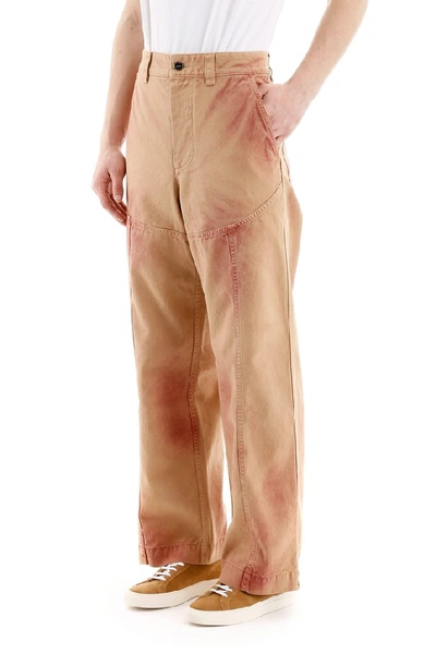 Shop Jacquemus Terraio Spray Paint Trousers In Orange