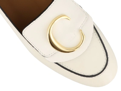 Shop Chloé C Plaque Loafers In White