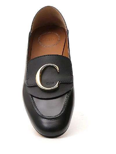 Shop Chloé C Plaque Loafers In Black