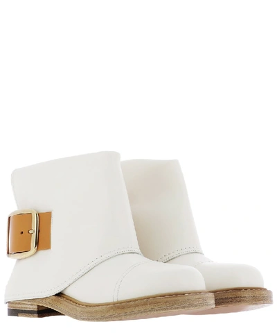 Shop Alexander Mcqueen Buckle Detail Ankle Boots In White