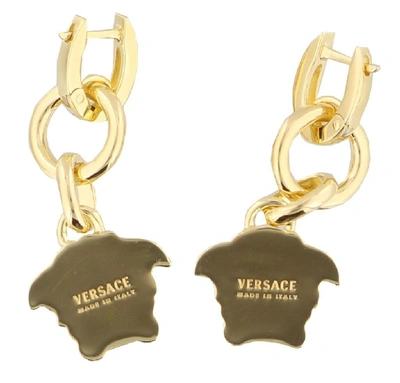 Shop Versace Medusa Earrings In Gold