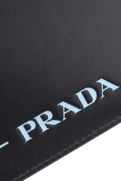 Shop Prada Logo Chain Clutch Bag In Black