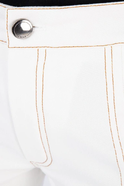 Shop Chloé Front Split Flare Jeans In White