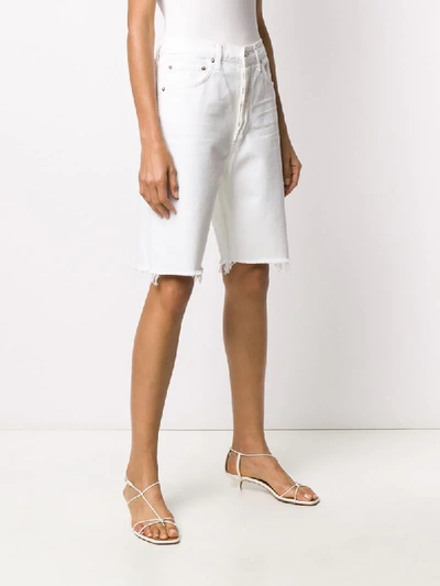 Shop Agolde Oversized Denim Shorts In White