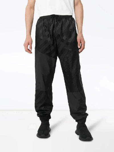 Shop Fendi Tonal Logo Track Pants In Black