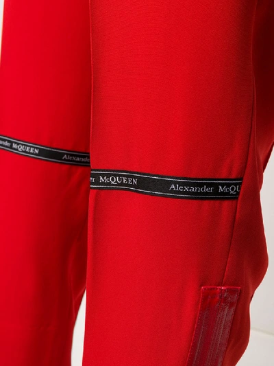 Shop Alexander Mcqueen Zip-cuff Trousers In Red