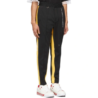 Shop Mastermind Japan Mastermind World Black And Yellow Tucked Track Pants In 2 Blk/ylw