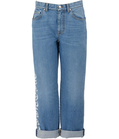 Shop Alexander Mcqueen Logo Cotton Jeans In Vintage Wash