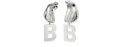 Shop Balenciaga Twirl B Earrings In Shiny Silver