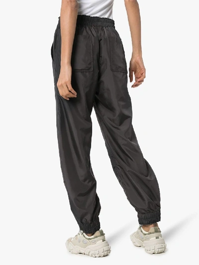 Shop Ganni Patch Pocket Track Pants In Black