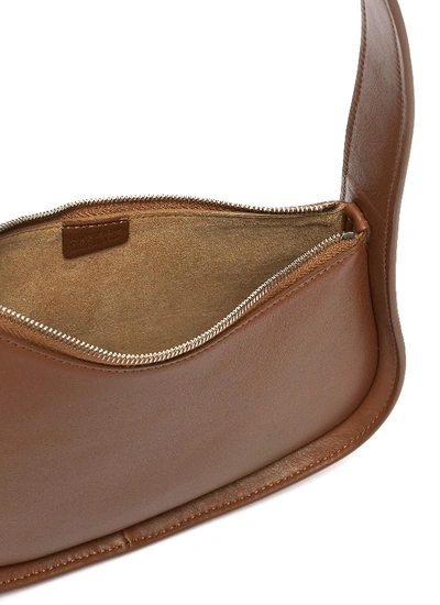 Shop The Row Half Moon Leather Bag In Brown