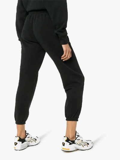 Shop Polo Ralph Lauren Logo Print Fleece Track Pants In Black