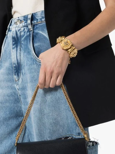 Shop Gucci Lion Head Bracelet In Gold