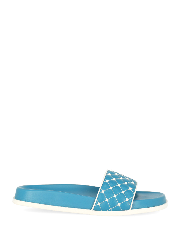in blue slippers