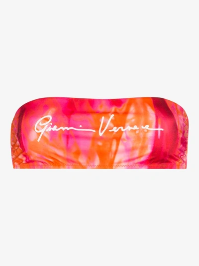 Shop Versace Gv Signature Print Bandeau Bikini Top In Pink
