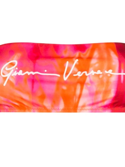 Shop Versace Gv Signature Print Bandeau Bikini Top In Pink
