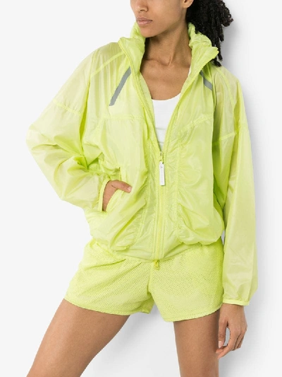 Shop Adidas By Stella Mccartney Hooded Performance Jacket In Yellow