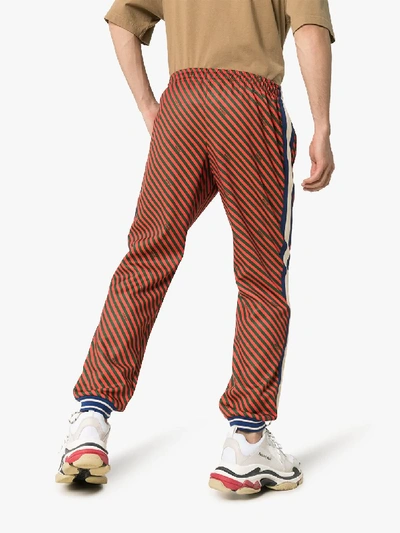 Shop Gucci Loose Striped Jogging Pant In Red