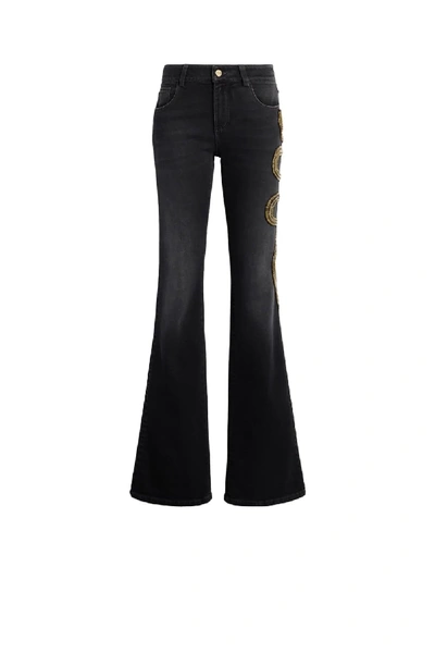 Shop Roberto Cavalli Snake Effect Sequin Flared Jeans In Black