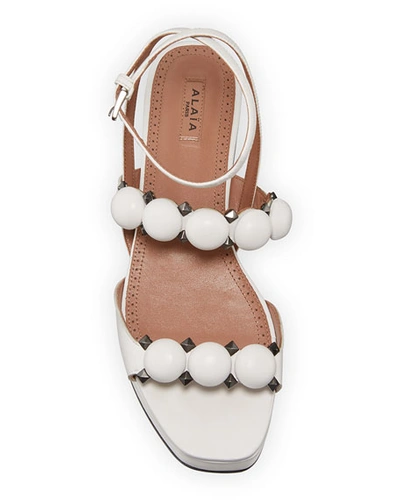 Shop Alaïa Bombe Stud Leather Platform Sandals In White