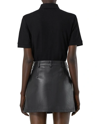 Shop Burberry Femme-fit Ring-snap Cotton Polo Shirt, Black
