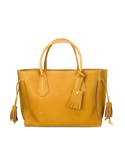 Shop Longchamp Penelope Grained Leather Tassel Tote In Yellow