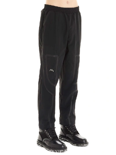 A-cold-wall* Logo Print Taped Nylon Track Pants In Black