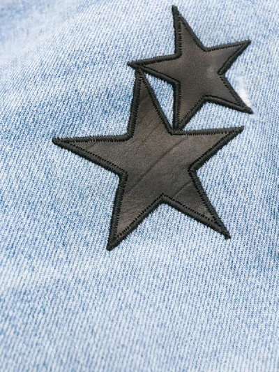 Shop Amiri Star Patch Flared Jeans In Blue