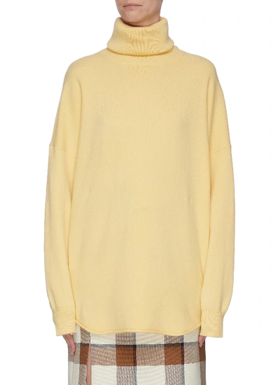 Shop Extreme Cashmere Puff Sleeve Cashmere Blend Turtleneck Knit Top In Yellow