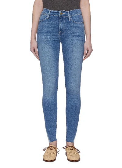 Shop Frame Raw Edge Skinny Jeans In Blue