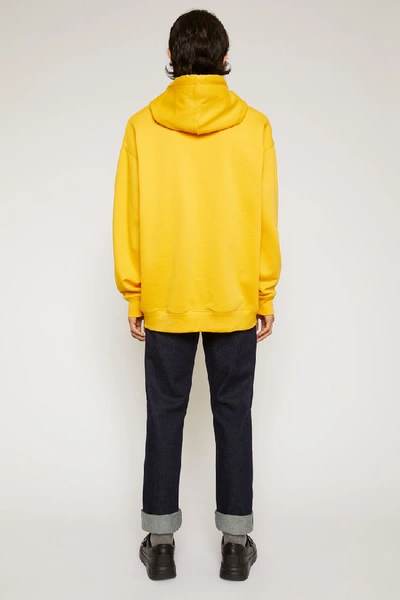 Shop Acne Studios Oversized Hooded Sweatshirt Honey Yellow