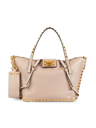 Shop Valentino Rockstud Pebbled Leather Tote In Poudre
