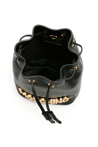 Shop Moschino Logo Mini Bucket Bag In Black