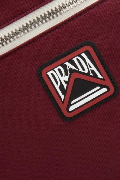 Shop Prada Logo Patch Drawstring Backpack In Red