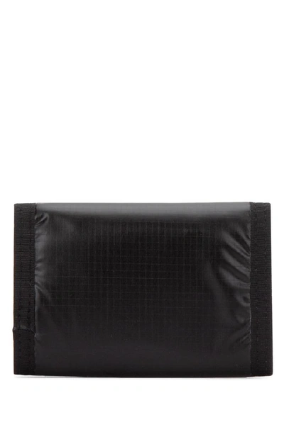 Shop Saint Laurent Logo Print Foldover Wallet In Black