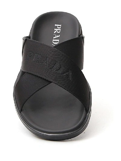 Shop Prada Cross Strap Slides In Black