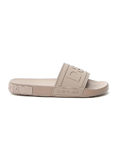 Shop Dolce & Gabbana Logo Embossed Slides In Beige