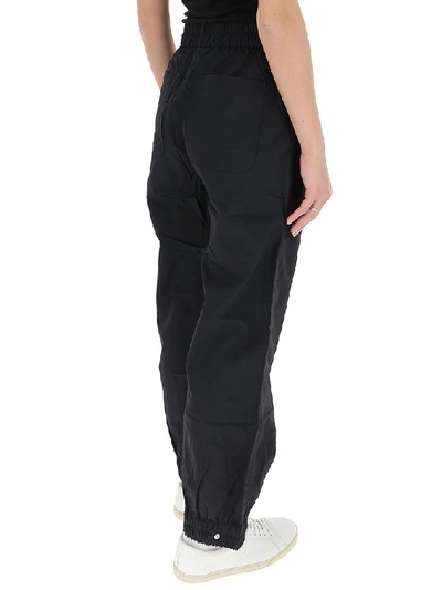 Shop Ganni Crinkled Tech Cargo Trousers In Black