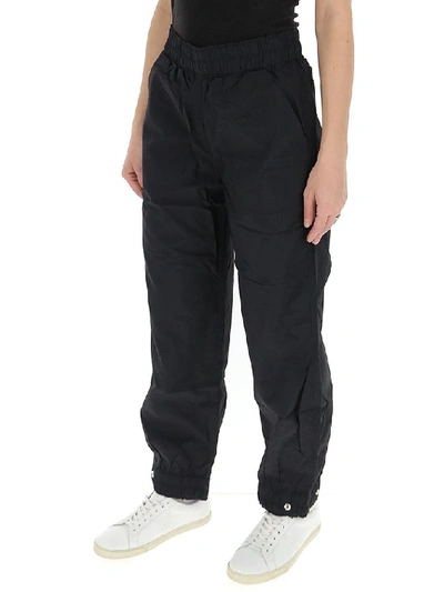 Shop Ganni Crinkled Tech Cargo Trousers In Black