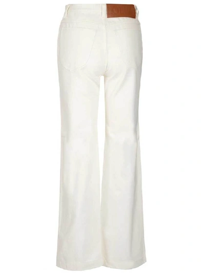 Shop Loewe Flared Denim Jeans In White