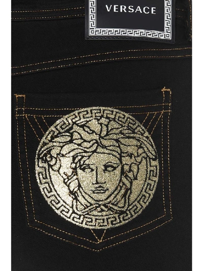 Shop Versace Slim Fit Jeans In Black