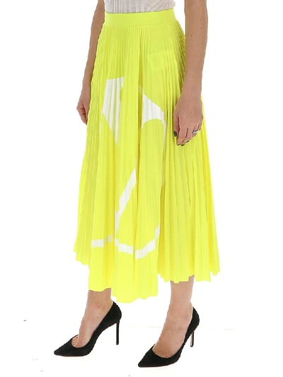 Shop Valentino Logo Pleated Midi Skirt In Yellow