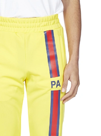 Shop Palm Angels Striped Panel Logo Track Pants In Yellow