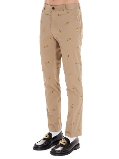 Shop Versace Safety Pins Embroidered Trousers In Beige