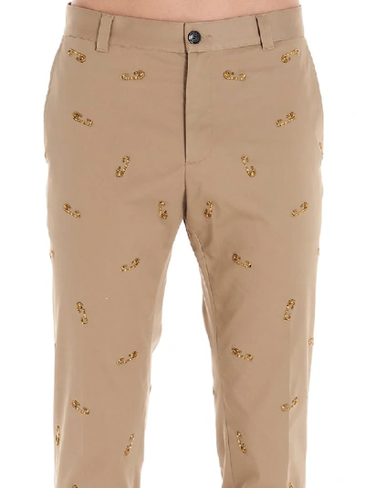 Shop Versace Safety Pins Embroidered Trousers In Beige