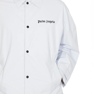 Shop Palm Angels Logo Print Raincoat In White