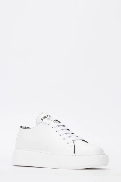 Shop Prada Logo Chunky Sole Sneakers In White