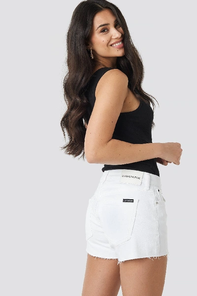Shop Calvin Klein Mid Rise Weekend Shorts White In Pop White