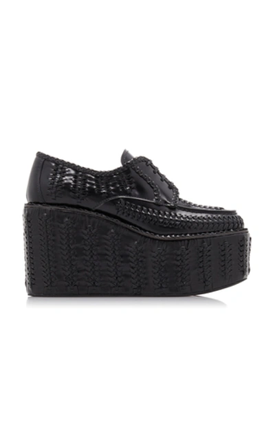 Shop Prada Woven Platform Loafers In Black