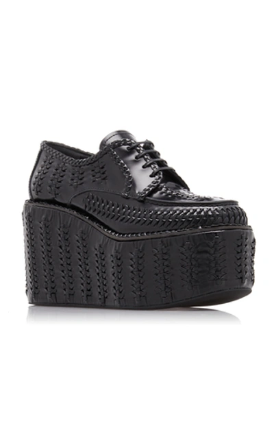 Shop Prada Woven Platform Loafers In Black
